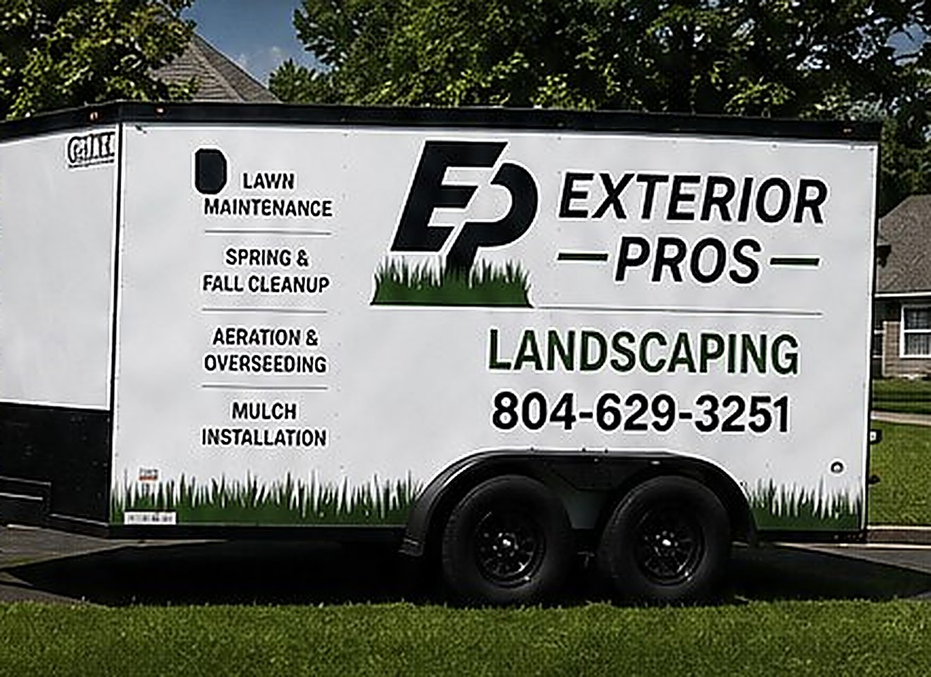 The Exterior Pros trailer, lettered with lawn maintenance, spring and fall cleanup, aeration and overseeding, and mulch installation